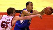 Kansas' Drew Gooden, right, beats Texas Tech's Andy Ellis to a
rebound. Gooden had 23 points and 10 boards in the Jayhawks' 94-82
victory on Saturday in Lubbock, Texas.
