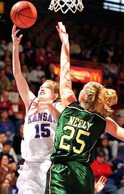 KU's Jennifer Jackson (15) shoots a layup against Baylor's Michelle
Neely. The Bears won, 85-80, Saturday at Allen Fieldhouse.