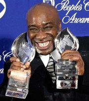 Actor Michael Clarke Duncan shows off two awards for the film "The
Green Mile" at the 27th annual People&squot;s Choice Awards in Pasadena,
Calif. Duncan starred in the film, which won for Favorite Motion
Picture and Favorite Dramatic Motion Picture.