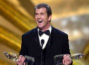 Actor Mel Gibson accepts his awards for favorite Motion Picture
Actor and favorite Motion Picture Star in a drama Sunday at the
27th annual People's Choice Awards in Pasadena, Calif.