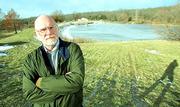 The frigid waters of Kansas University's Lake Hutton behind him,
Bob Buddemeier ponders water issues for the Kansas Geological
Survey. Buddemeier is tracking declines in groundwater supplies in
western Kansas.