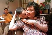 Phan Thi Kim Phuc and her family now make their home in Toronto. AP
Photographer Nick Ut, who made this photo, also shot a famous
picture of Kim Phuc running screaming up a road after the bombs
struck.