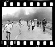 South Vietnamese forces follow terrified children, including
9-year-old Phan Thi Kim Phuc, center, as they run down Route 1 near
Trang Bang, Vietnam, after an aerial napalm attack on June 8, 1972.
A Vietnamese Air Force bomber accidentally dropped its flaming
napalm on South Vietnamese troops and civilians. The terrified girl
had ripped off her burning clothes while fleeing.