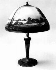 Moe Bridges Co. of Milwaukee, Wis., made many lamps with
hand-painted glass shades. This mid-1920s lamp is worth more than
$3,000.