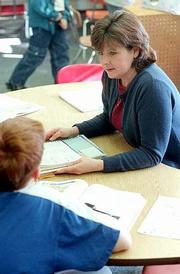 Dozens of special-education teachers and staff who work with
emotionally disturbed students are injured on the job annually in
the Lawrence school district. Among them last year was
paraprofessional Becky Chappell, above, who was injured last April
when a student tripped her.