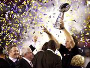 Baltimore coach Brian Billick hoists the Vince Lombardi trophy
following the Ravens' victory over the New York Giants in Super
Bowl XXXV. The Ravens won, 34-7, Sunday at Tampa, Fla. Ravens owner
Art Modell is second from left.