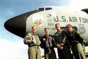 About 50 members of the Topeka-based 190th Air Refueling Wing live
in Lawrence. Above, Lawrence pilots Ken Oliver, Jeff Warrender and
Chuck Remboldt and navigator Cathy Hambleton stand with one of the
wing's 11 KC-135 tankers at Forbes Field.