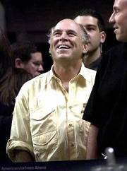 Singer Jimmy Buffett laughs as fans cheer as he stands at the end
of the tunnel overlooking the final minutes of overtime play
between the New York Knicks and the Miami Heat Sunday Feb. 4, 2001
at the American Airlines Arena in Miami. Referee Joe Forte ejected
Buffett from his seat along the baseline for using profanity.