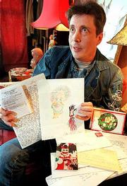 An interest in unusual and bizarre collectibles led Randy Walker to
his fascination with serial killer memorabilia. Walker, Lawrence,
is shown Friday with items from infamous murderers including Henry
Lee Lucas, David Berkowitz and John Wayne Gacy.