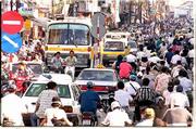 Saigon's afternoon rush hour fills the streets from curb-to-curb on
Duong Nguyen Van Troi street, near Tan Son Nhut Airport. Exaust
fumes and the sounds of engines and beeping horns are almost
constant in Vietnam's largest city of 7 million. There are an
estimated 2 million motorbikes in the huge province that covers
over 1200 square miles.