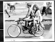 A South Vietmanese soldier and his companion rolled through the
streets of Saigon in 1969 on their vintage Sachs motorbike.
