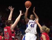Kansas Forward Jaclyn Johnson scores two of her 20 points against
Texas Tech. The Red Raiders held off the Jayhawks, 49-45, Wednesday
night at Allen Fieldhouse.