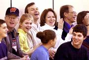 Wisconsin Gov. Scott McCallum and his wife, Laurie, applaud during
a recent basketball game at James Madison Memorial High School in
Madison, Wis. The McCallums' son, Rory, plays for James Madison.
Also shown are the couple's other children, Cara, 13, in
light-colored shirt, and Zachary, 18, bottom right. The McCallums
are members of the Christian Scientist church.
