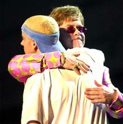 Elton John and Eminem embrace at the conclusion of their duet
Wednesday at the 43rd annual Grammy Awards in Los Angeles.