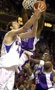 Nick Collison drives the baseline on Kansas State's Kelvin Howell.
Collison had 11 points Friday at Kemper Arena.