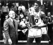 Former KU player Norm Cook, seen receiving his Big Eight Conference Freshman of the Year Award from Chancellor Archie Dykes, has a son on Illinois' basketball team.