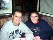 Kansas University alums Robert Tracy and Jenifer Dodd are still
happy at halftime of Friday's game. They were among more than 200
Jayhawk fans shoehorned into a New York sports bar to cheer on
their team.