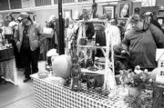 Hundreds of "lookers" pass through the Tulsa Flea Market on
Saturdays to check out a variety of items ranging from yard sale
goods to quality antiques.