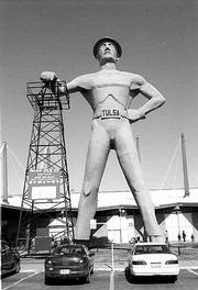 A huge statue of an oil field worker is the landmark of the
Oklahoma State Fairgrounds. The Tulsa Flea Market is in the second
building behind the statue.