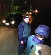A convoy containing former Yugoslav President Slobodan Milosevic
leaves his residence in Belgrade. A 26-hour armed standoff ended
early today when Milosevic surrendered and was taken to prison.
Milosevic was forced from office in October by mass demonstrations
and has been indicted by the U.N. war crimes tribunal in The Hague,
Netherlands.
