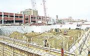 Work continues downtown on the new Lawrence Arts Center,
foreground, and a four-story parking garage in the 900 block of New
Hampshire.