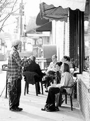 Enjoying coffee drinks at The Bourgeois Pig, 6 E. Ninth St., are,
from left, Adam Coch, Carmen Anello and Ann Turner.