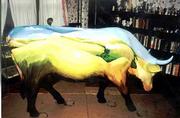 Susan McCarthy&squot;s CowParade entry, "Cow Grazing in the Flint Hills,"
features pastoral landscape scenes.