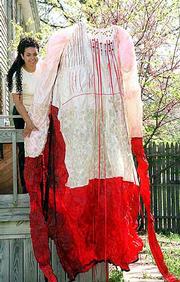 Christina Frazier, 31, was diagnosed two years ago with a rare
blood disease. During her illness Frazier, a KU student set to
graduate in May with a bachelor's degree in art, continued to
create artwork. One of her most significant works, finished in a KU
Med Center hospital bed, was a 9-foot dress designed to symbolize
her continual blood loss. "It's kind of a map of my illness,"
Frazier said. "That's how art works you try to work through your
feelings, and that's why it just got so big.