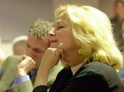 Margey Frederick watches her husband's resignation announcement.
Bob Frederick stepped down Thursday at Hadl Auditorium.