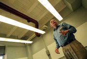 The questionable acoustics of a Marvin Hall classroom draws the
scrutiny of Bob Coffeen, chairman of KU's architectural engineering
department. Coffeen and several KU students have produced an
Acoustical Society of America publication that has been distributed
internationally.