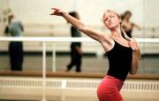 Her fellow dancers reflected in the mirror behind her, Deanna Doyle
dances during a rehearsal Thursday night of Tom Ralabate's
"Insides." The work is part of a University Dance Company concert
that will be presented Thursday and Friday at the Lied Center.