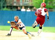 Amy Hulse, left, covers first base after Oklahoma's Erin Evans (15)
put down a bunt. The play came in the Sooners' 2-1 victory over the
Jayhawks on Saturday at Jayhawk Field.