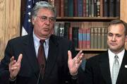 House Majority Leader Dick Armey, R-Tex., talks to reporters
Wednesday after the House voted to approve the fiscal 2002 budget.
House Budget Committee Chairman Jim Nussle, R-Iowa, is at right.