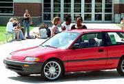 The chance to win a red Honda Civic gets the attention of Free
State High School seniors from left, Johanna Carttar, Joy Jackson
and Shauntae Rozzelle. The trio of girls inspected the car Monday.
It will be given away at Project Graduation 2001, a party at The
Granada, 1020 Mass.