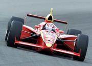 Racer Tony Stewart drives through the first turn at the
Indianapolis Motor Speedway on Thursday. Stewart plans to compete
in both the Indy 500 and Coca-Cola 600 NASCAR Winston Cup race on
Sunday.