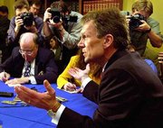 Roles reverse today in the U.S. Senate for Minority Leader Tom
Daschle, D-S.D., left, and Majority Leader Trent Lott, R-Miss.
Daschle becomes the majority leader as Democrats take control of
the Senate.