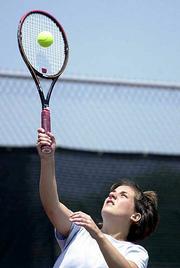Gabrielle giertz slams a forehand in a mixed doubles match Sunday
at the Lawrence Open. Giertz placed first in women's open singles
at the weekend event.