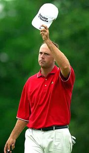 Stewart cink waves to the gallery on the 18th hole. Cink fired a
3-under-par 67 Saturday to move into a tie for the lead.