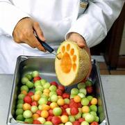 To make melon balls from a halved melon: Insert the melon baller
into the fruit, twisting the scoop to make a perfect round. Melon
ballers come in a wide range of sizes and shapes, from tiny scoops
the size of young green peas to oval, fluted or scalloped scoops.