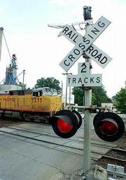 The Union Pacific railroad line from Topeka and Lawrence to Kansas
City, Mo., has been identified as an option for a commuter rail
line. Here, a coal train passes Wednesday on the Union Pacific
tracks in North Lawrence.