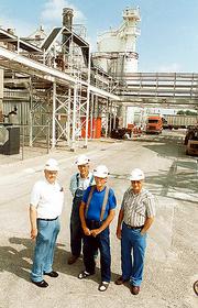 Westvaco retirees have vivid memories of the Flood of 1951,
especially the never-ending mud and silt they had to clean up after
water receded. From left, Bill Torneden, 80, former project
engineer; Bob Snow, 80, former warehouse foreman; Joe Shobe, 74,
former maintenance worker; and John Newman, 84, former shift
supervisor; stand in a spot in the Astaris plant that was
completely flooded 50 years ago. See related story pages 13-14.