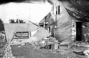 Even on relatively high ground, some houses and property weren't
spared from the ravages of the floodwaters. Harry Workman's house,
801 Lake St., sustained substantial damage when the garage
collapsed.