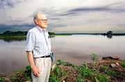 Wakefield Dort has been studying the Kansas River for a quarter
century. As storm clouds loom, Dort keeps watch on the
fastest-eroding bend in the Kaw, the Eudora Bend.