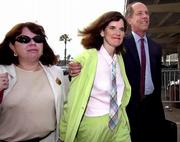Comedian Paula Poundstone, center, has pleaded innocent to child
molestation charges. She was accompanied Tuesday to Los Angeles
County Superior Court by publicist Jan Frazier, left, and attorney
Steven Cron.