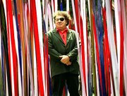 Artist Dale Chihuly stands amid "Reeds," one of his glass
installations, at the Victoria and Albert Museum in London. The
artist now has work in more than 180 museums worldwide, including
the Helen Foresman Spencer Museum of Art at Kansas University.