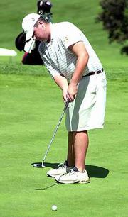 Pete Krsnich putts on the second hole during the KJGA Match Play
Tournament at Lawrence Country Club Wednesday.