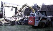 Workers tear down three smaller theaters on the southwest side of
Indian Hills Theater in Omaha, Neb. The demolition took place
Tuesday. The one theater that houses a Cinerama screen, believed to
be the largest Cinerama screen in the nation, may be demolished
despite a preservation effort.