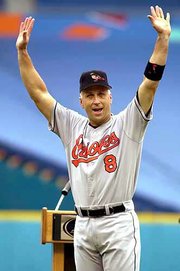 Baltimore's Cal Ripken Jr. reacts to the cheers of the crowd during
a ceremony honoring his baseball achievements prior to their game
against the Florida Marlins. Ripken was honored July 15 in Miami.