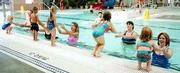 Three- and 4-year-olds participating in the parent/child swimming
class jump into the arms of a parent at the Lawrence Indoor Aquatic
Center. From left are: Holly Swearingen, 3, and her father, Rocky;
Joshua Dreiling, 3, and his mother, Linda; Mckenzie Brungardt, 3,
and her mother, Lori; instructor Larry Goltz; Kayla Lee, 4, and her
mother, Angie, and Amber Draper, 3, and her mother, Sherry.
