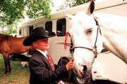 Sunny seems pleased while being admired by his master, Braden
Buckley, 12, of Baldwin. Braden won a blue ribbon with his
grandma's white quarter horse Saturday morning at the Douglas
County 4-H horse show.